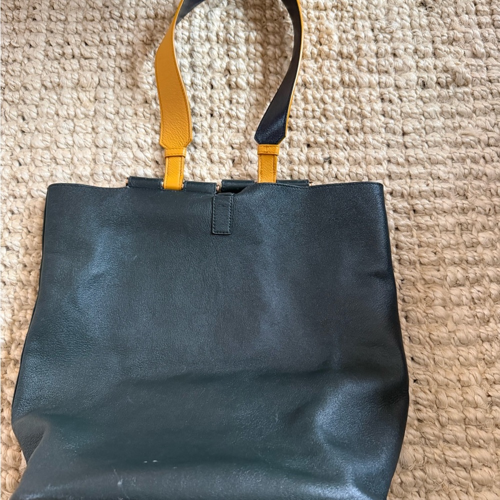Gabriela Hearst Elegant Black Leather Tote with Yellow Strap